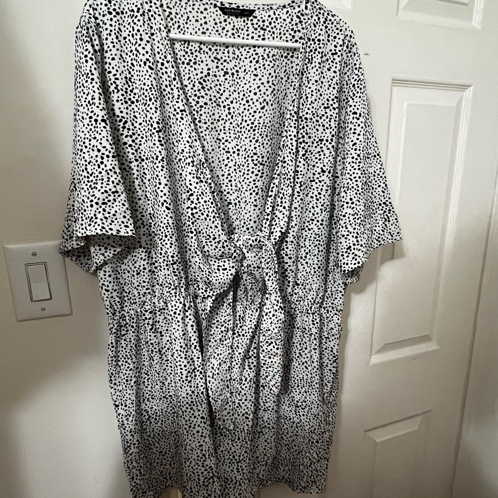 Black poka dot romper with a tie